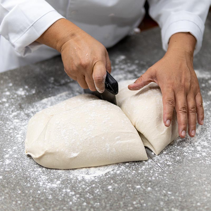 chef making pizza dough